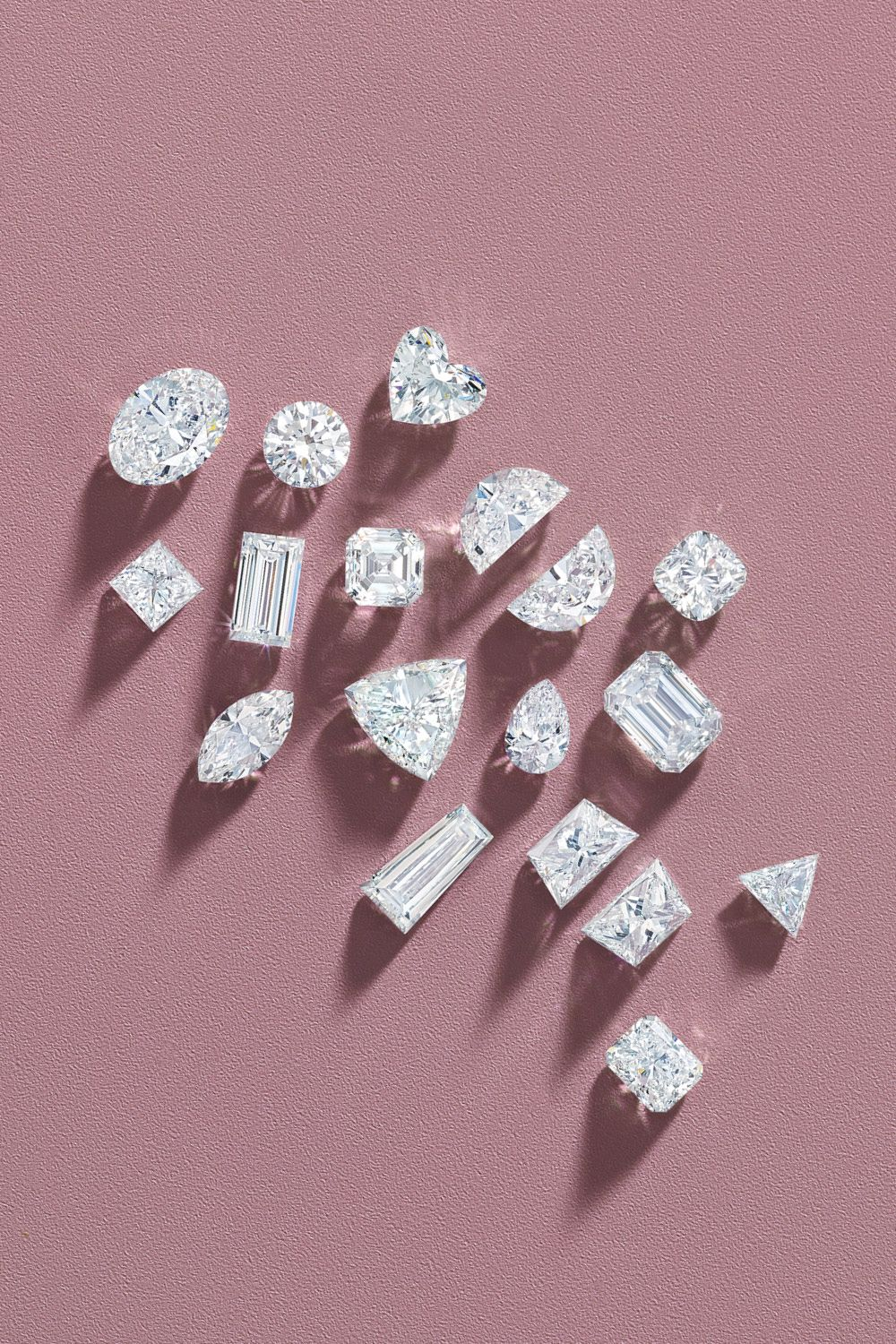 Illustrated guide showing ten popular diamond cuts including round, princess, oval, cushion, emerald, pear, marquise, radiant, asscher and heart shapes
